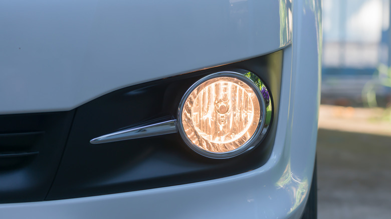 Open fog lamp on SUV