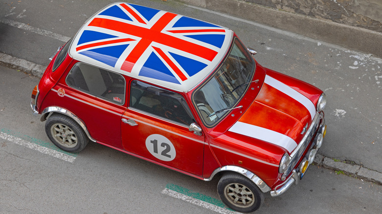 Overhead view of a red Mini with a UK flag on the roof.