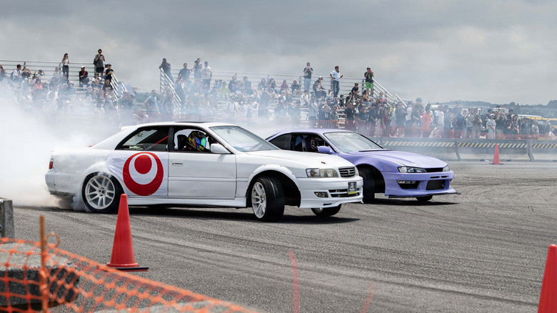 Fans watch cars drift during America Fest 2026 at Kadena Air Base in Japan, on April 12, 2026.