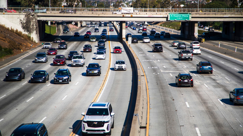 A busy American highway with lots of cars