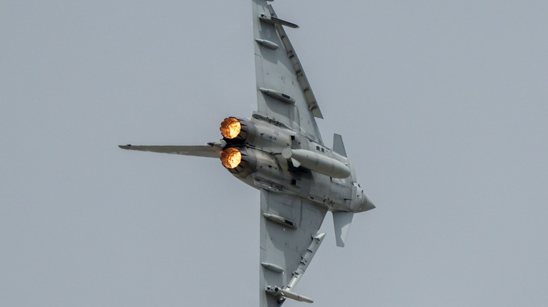 A Eurofighter Typhoon flies at steep angle