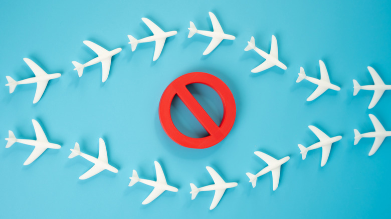 An illustration of passenger planes avoiding a no-fly zone