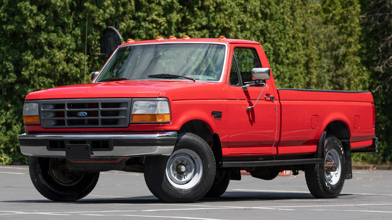 A 1996 Red Ford F250 XL on a sunny day