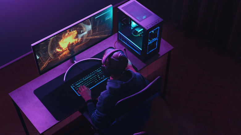 Person playing video game on PC