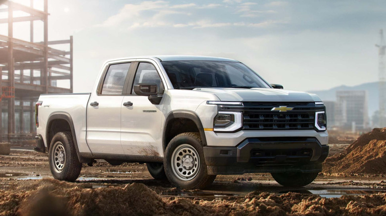 Front 3/4 view of 2027 Chevy Silverado Work Truck on job site.