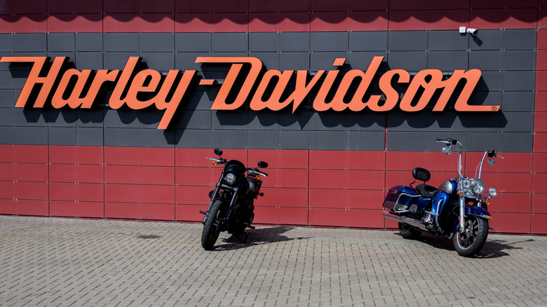 Harley-Davidson logo on dealership building.