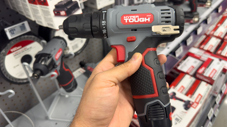 Close-up of hand holding compact Hyper Tough cordless drill