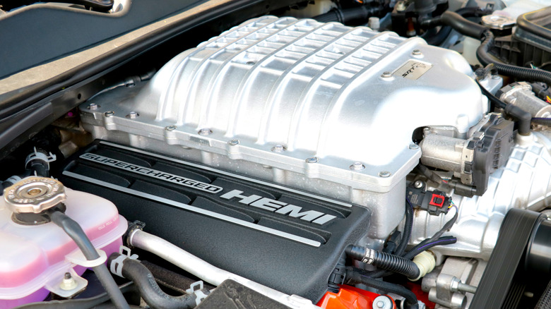 An engine compartment showcasing a HEMI supercharged engine.