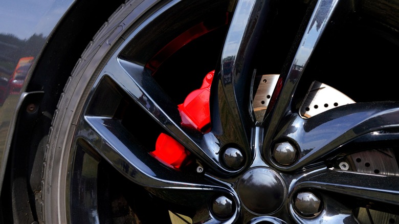 drilled and slotted brake rotors in a car's wheels