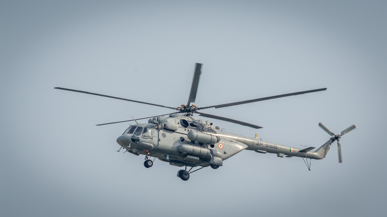 An army helicoper hovering in the sky