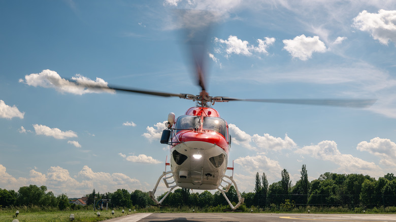 A helicopter hovering near the ground