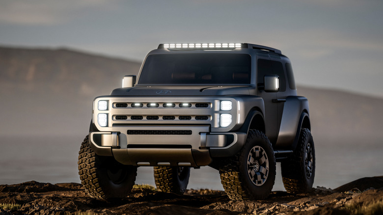 The Hyundai Boulder SUV concept rests on a rocky surface, front 3/4 view, CG render