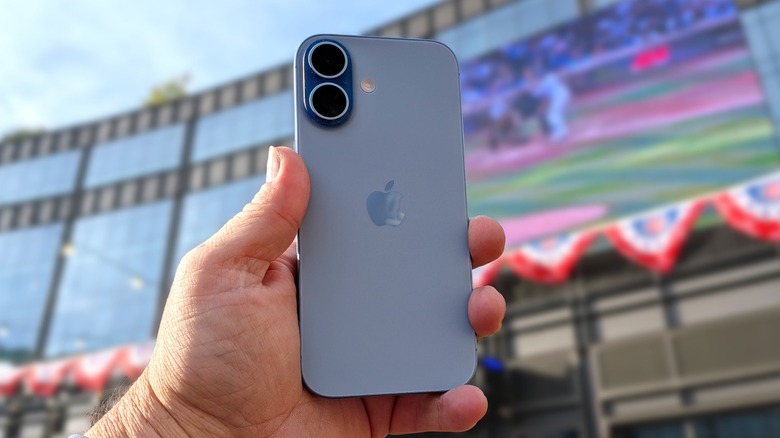 iPhone 17 held in a man's hand
