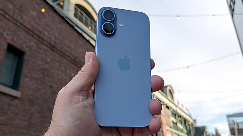 iPhone 17 held in a man's hand