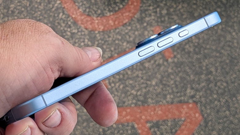 iPhone 17 held in a man's hand