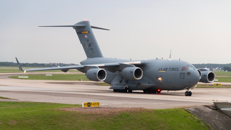 A Globemaster C-17 on an airport runway.