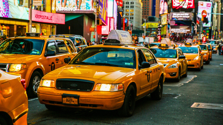 Ford Crown Victoria taxicab in service at Times Square, front-left 3/4 view