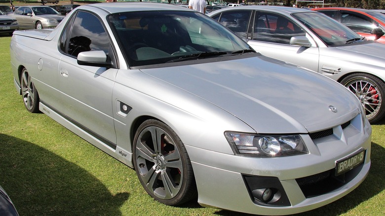 A silver Holden VZ Ute with a metal tonneau cover, front 3/4 view