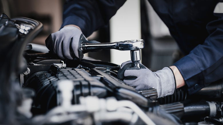 Professional mechanic working on a car