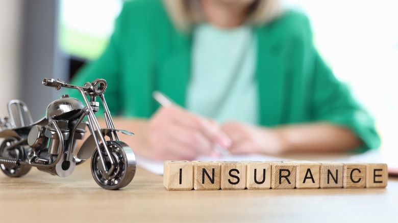 Motorcycle, travel and medical insurance concept.