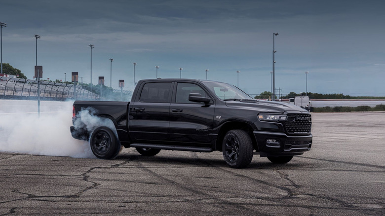 Black 2026 Ram 1500 doing burnout