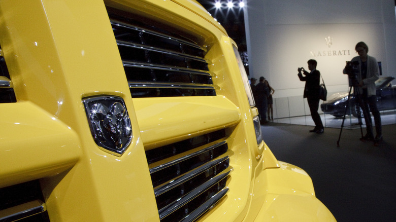 Front grille of yellow Ram truck at auto show