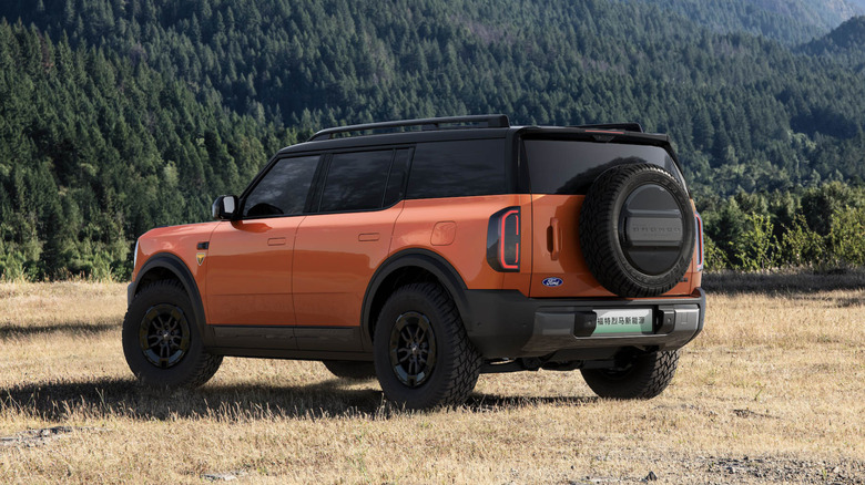 Rear 3/4 view of the Ford Bronco New Energy in orange