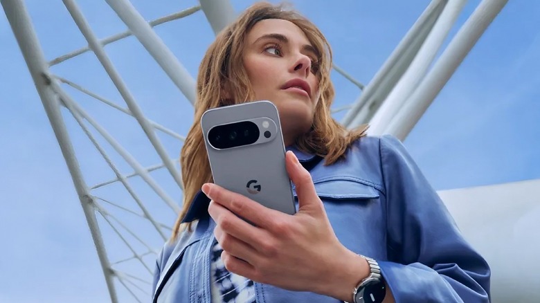 A woman holds the Pixel 10