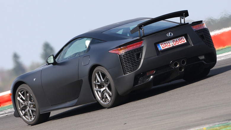 A black Lexus LFA testing on a track.