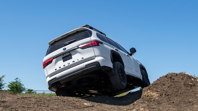 A white 2025 Toyota Sequoia traversing a hilltop