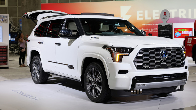 A white Toyota Sequoia on display at an auto show