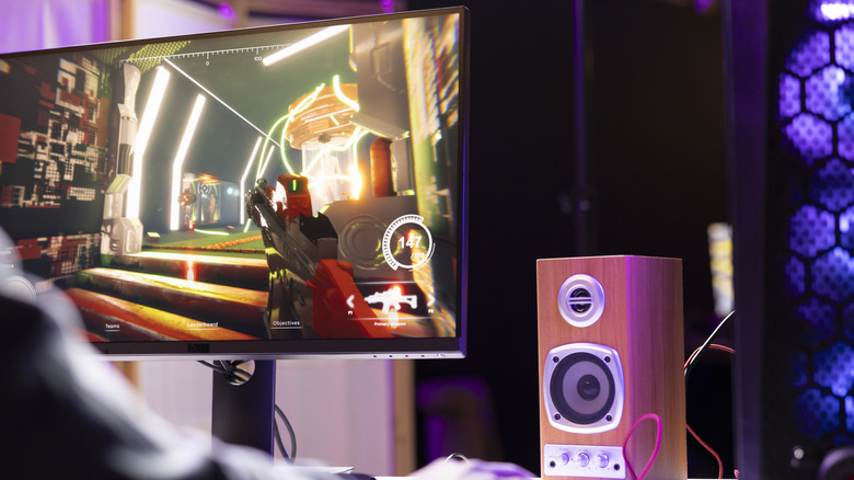A person playing a first person shooter game on PC