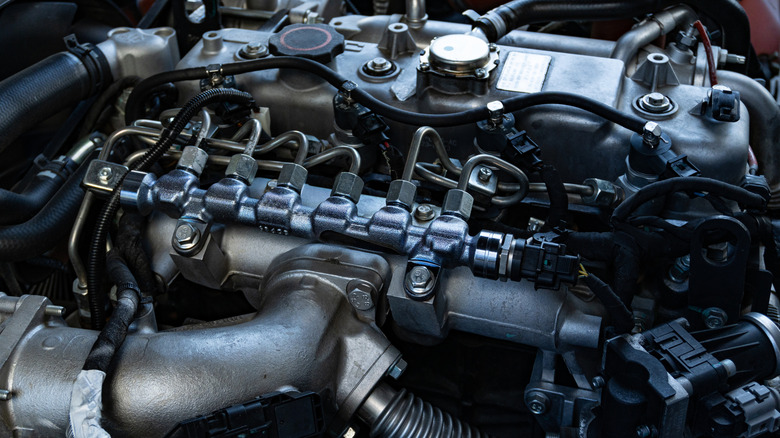 A truck's engine bay uncovered.