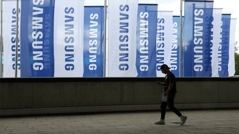 Samsung logo flags near pedestrian
