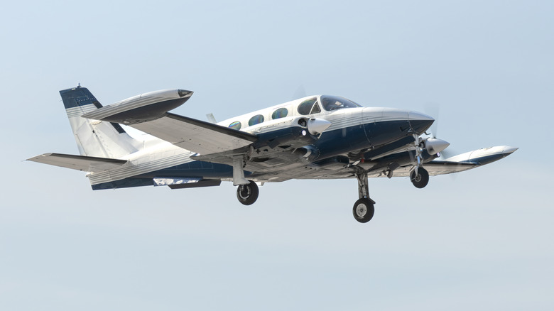 Twin-engine aircraft flying
