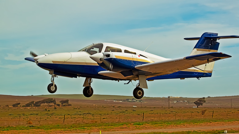 Twin-engine plane lands near field