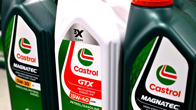 Bottles of three different Castrol motor oils on a shelf