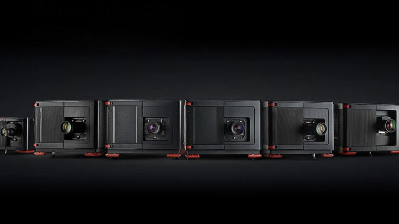 Laser movie projectors pictured against a black background