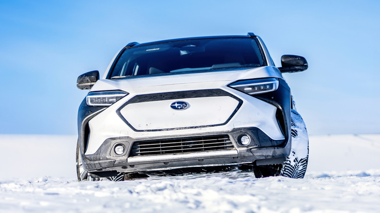 Subaru electric car moving in snow.