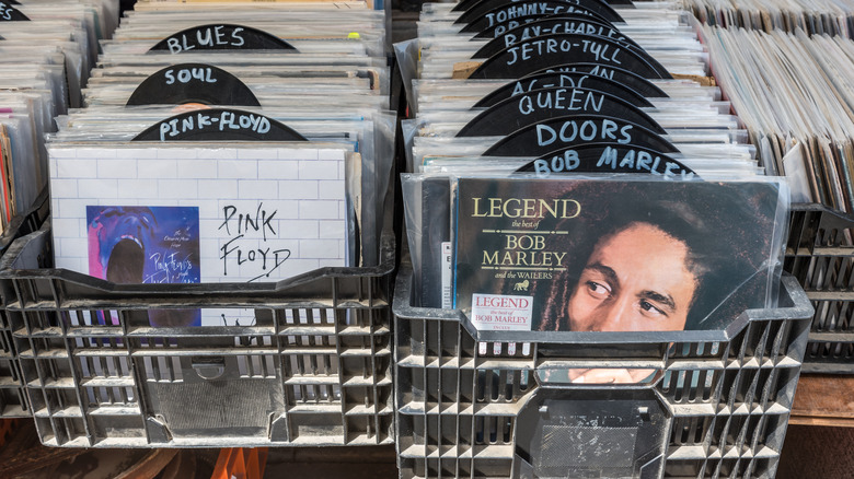 vinyl records in milk crates being sold at a flea market