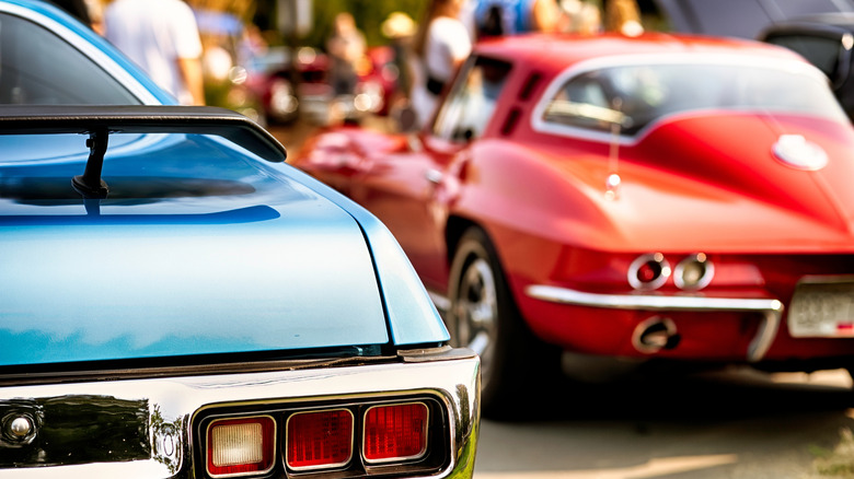 Close-up of 1971 Plymouth GTX right-side taillight with 1964 Chevrolet Corvette Stingray in background