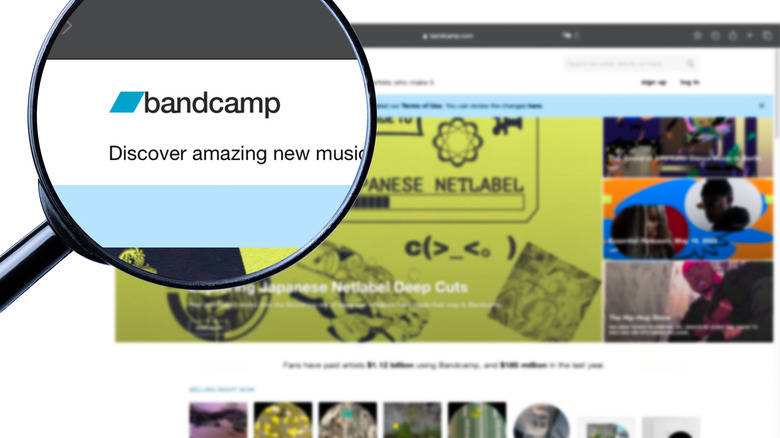 Bandcamp home page with magnifying glass over logo