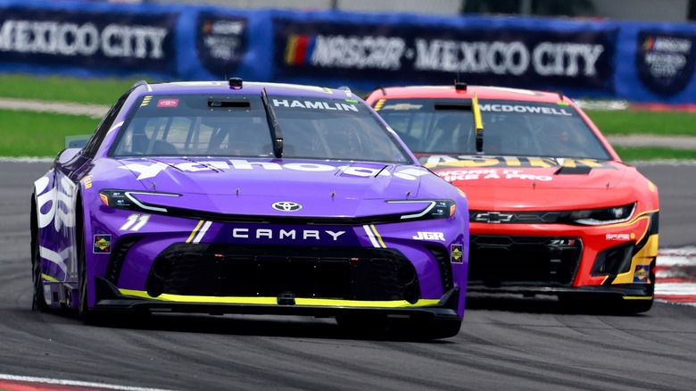 Purple NASCAR Toyota Camry racing red Ford NASCAR