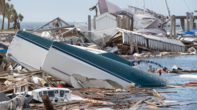 Storm damage with upturned boats and wrecked buildings
