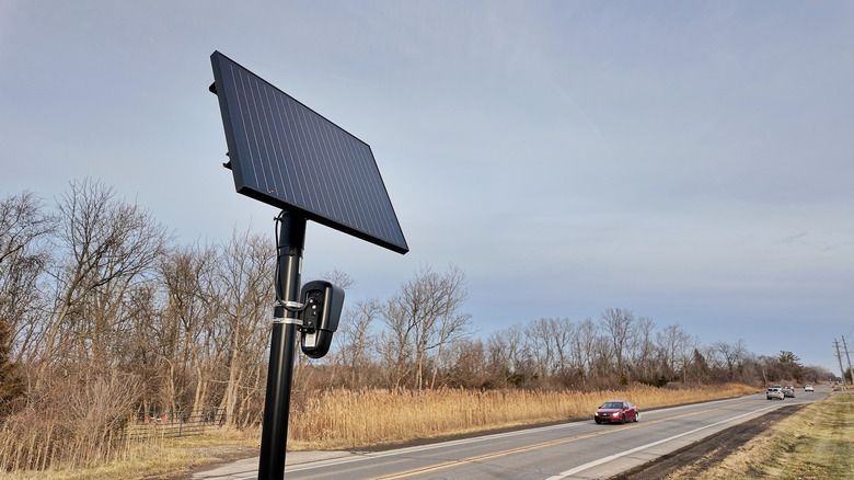 Flock Safety camera near two-lane roadway