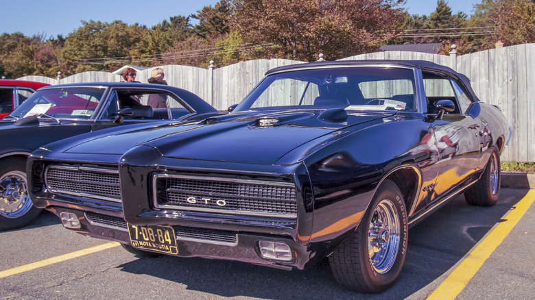 1969 Pontiac GTO parked in lot, front-left 3/4 view