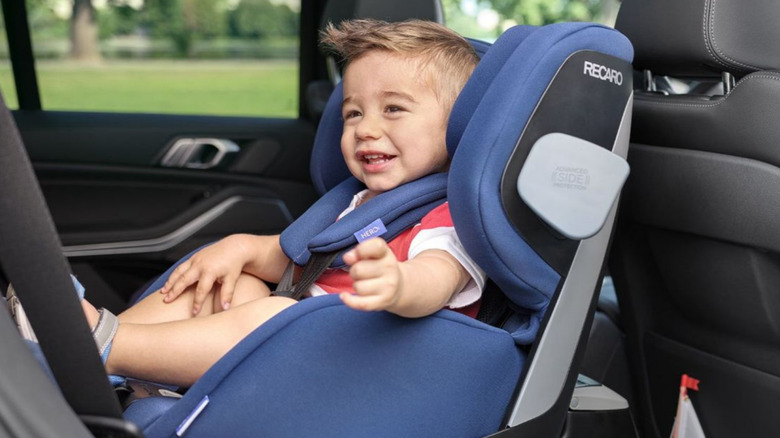 Child sitting in rear facing car seat