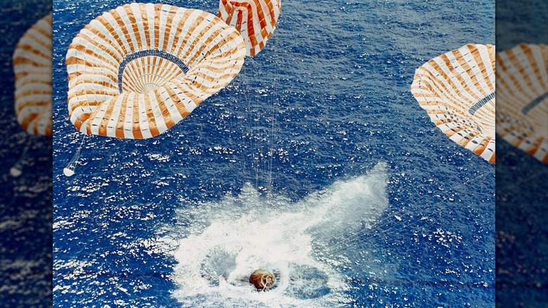 The Apollo 15 Command Module with astronauts David R. Scott, Alfred M. Worden, and James B. Irwin, splashdown some 330 miles north of Honolulu, Hawaii, on August 7, 1971.