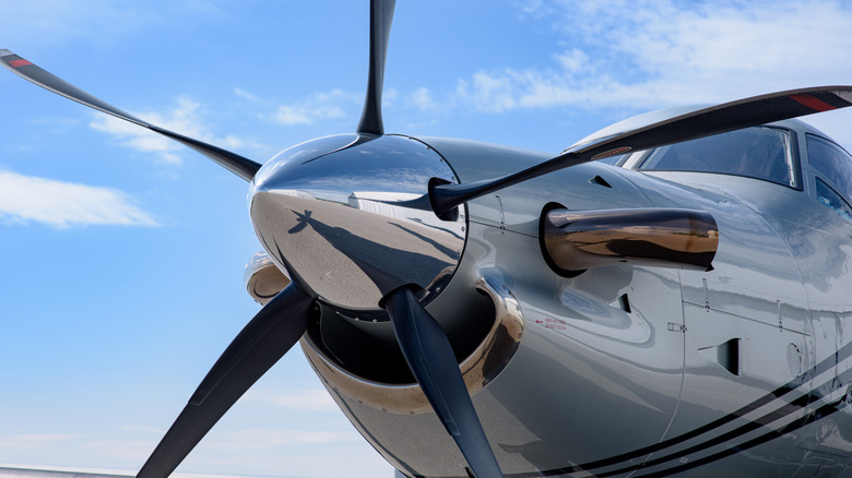 A close-up of the propeller on a single-engine plane