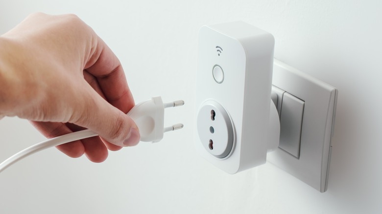 person using smart plug